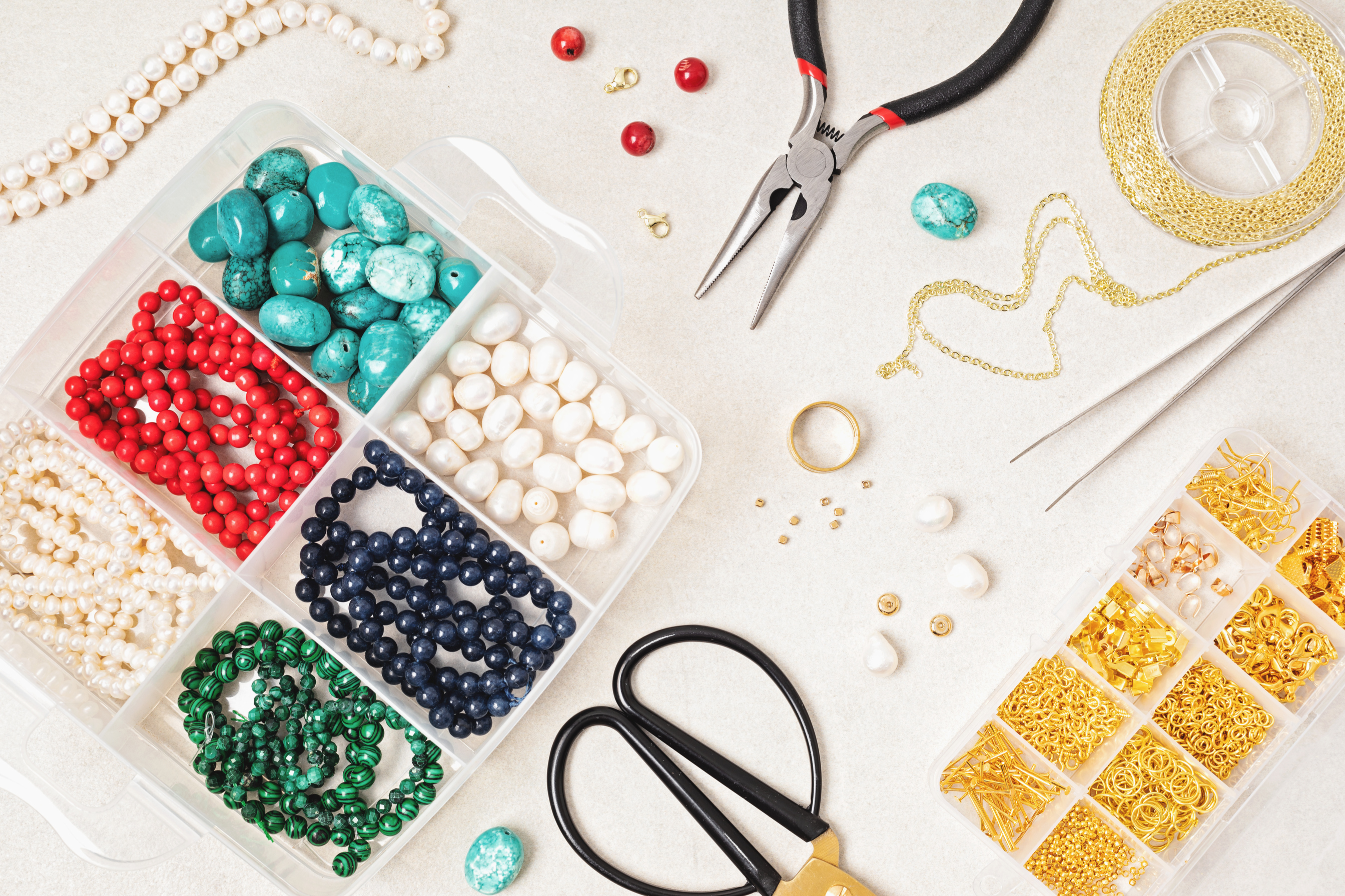 Jewelry making flatlay with semi-precious stone beads and tools. Handmade jewelry, small business, hobby concept